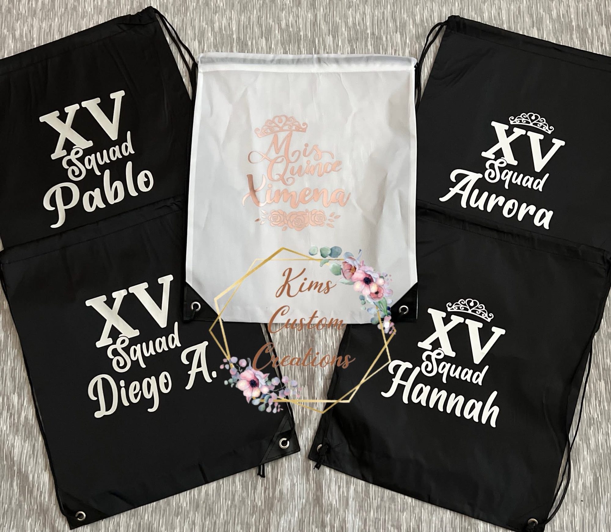 Personalized XV Squad drawstring bags in black and white with quinceanera court member names