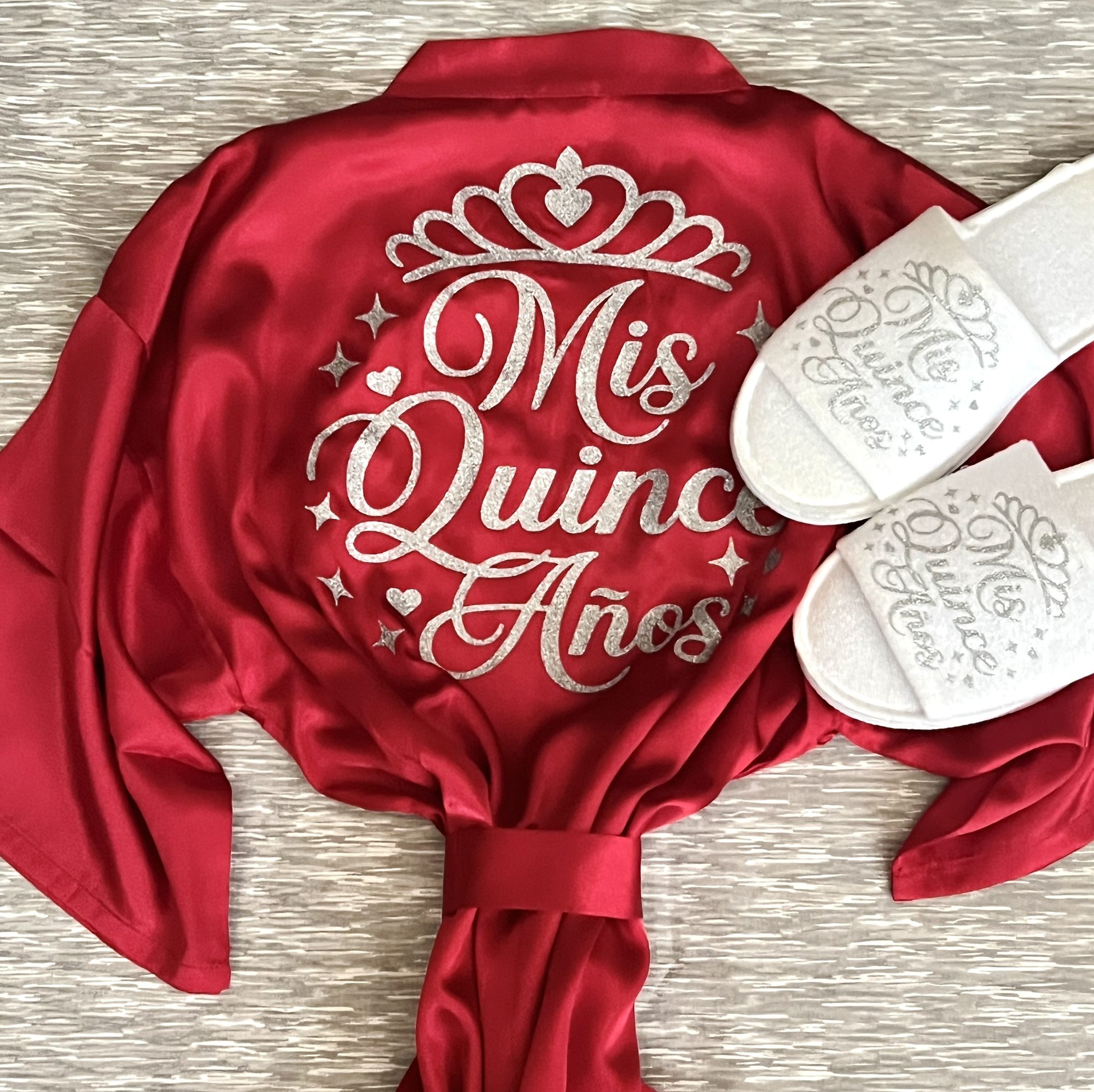 Red satin Mis Quince Anos robe with silver glitter tiara design and matching slippers