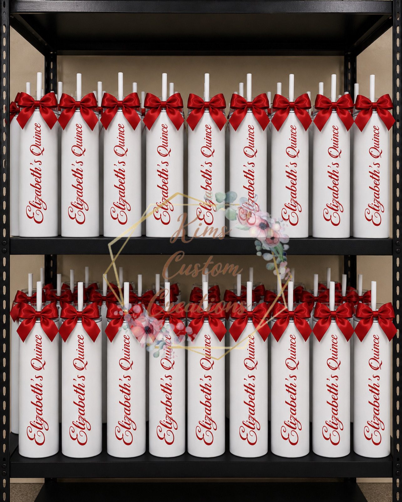 White personalized quinceanera tumblers with red satin bows and straws stocked on shelves