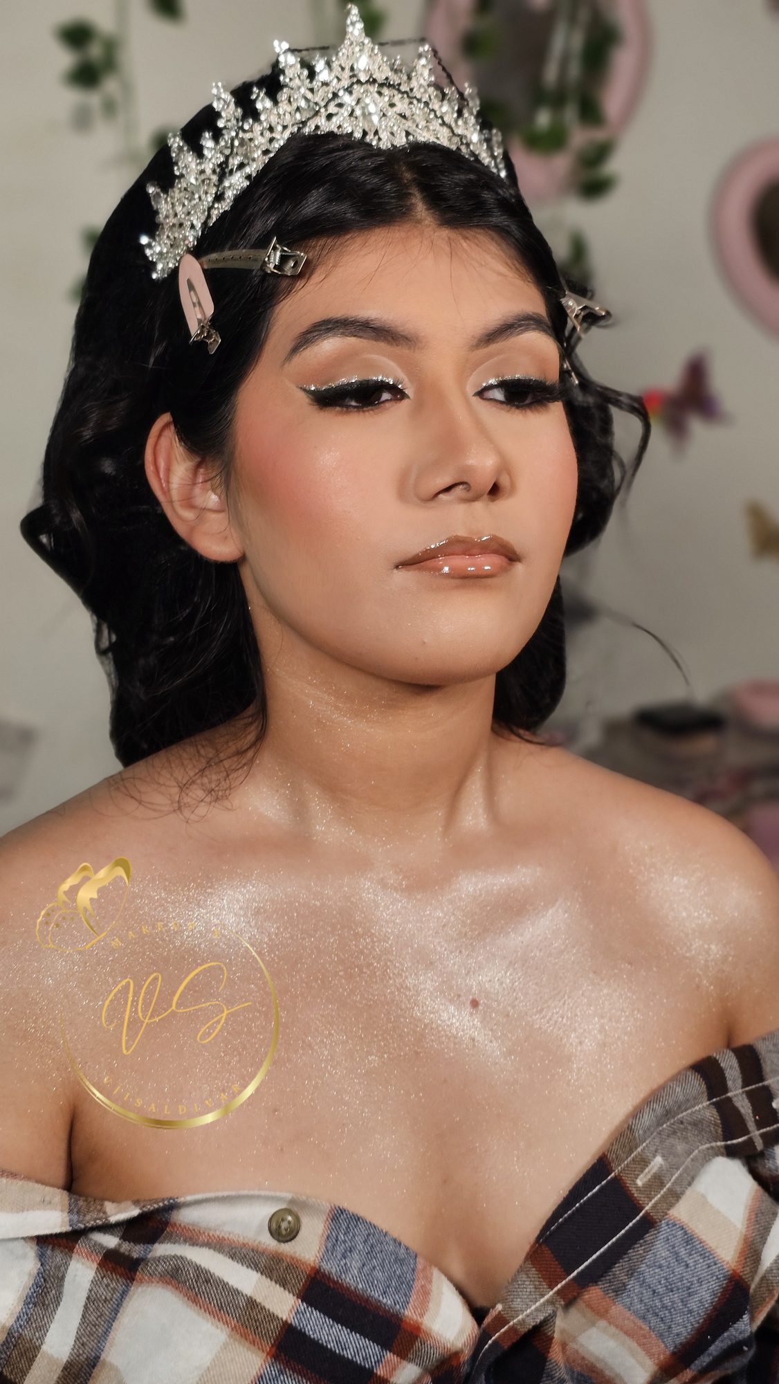Quinceanera soft glam makeup with silver glitter eyeliner, glossy nude lips, and a crystal tiara by Makeup X Viisaldivar in Fort Worth