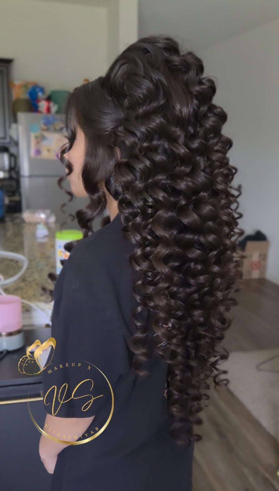 Voluminous half-up quinceanera hairstyle with long defined spiral curls by Makeup X Viisaldivar